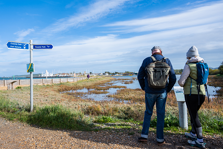 Couple walking on the Isle of Wight Coastal Path in Yarmouth