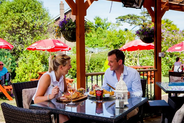 Enjoy downland views from the heated veranda at The Pointer Inn