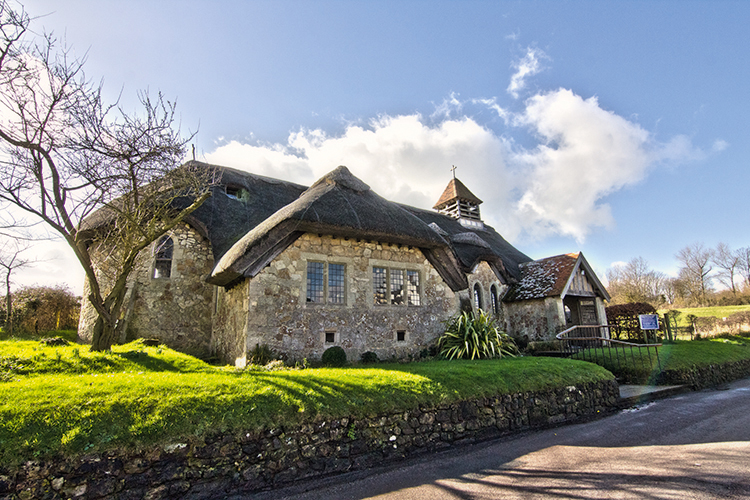 The thatched church of St. Agnes at Freshwater Bay.
