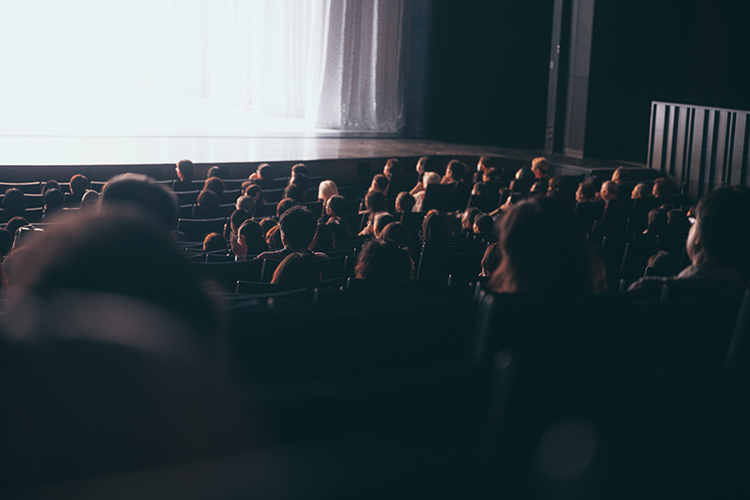 Theatre interior with an audience watching a show
