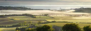 View of Bembridge on the Isle of Wight, showing fields and coast.